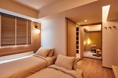 a bedroom with two beds and a window at LiveGRACE Mabuji Park Hotel - Vacation STAY 51965v in Tokyo