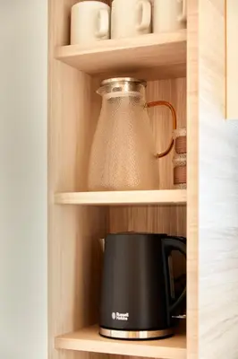 a black toaster and a pot in a kitchen cabinet at LiveGRACE Mabuji Park Hotel - Vacation STAY 51980v in Tokyo