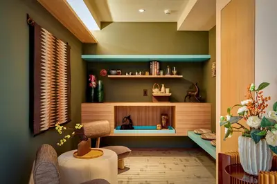 a living room with green walls and a table and chairs at LiveGRACE Mabuji Park Hotel - Vacation STAY 51980v in Tokyo