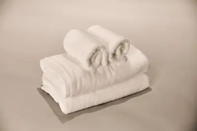 a stack of white towels sitting on a table at LiveGRACE Mabuji Park Hotel - Vacation STAY 51980v in Tokyo