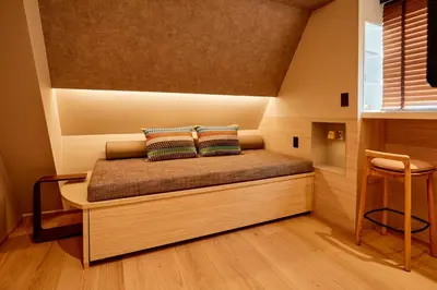a bed with two pillows on it in a room at LiveGRACE Mabuji Park Hotel - Vacation STAY 51980v in Tokyo