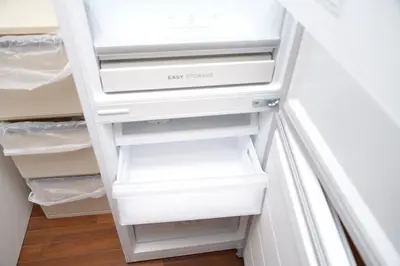 a white refrigerator with two drawers in a room at la3 hotel annex \u65b0\u5bbf\u4e09\u968e\u5efa\u3066\u4e00\u8ed2\u5bb6 in Tokyo