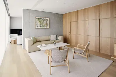 a living room with a couch and a table and chairs at TRUNK(HOTEL) YOYOGI PARK in Tokyo