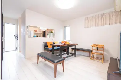 a living room with a dining room table and chairs at 3 BR house 7 mins on foot from Otsuka on the Yamanote Line in Tokyo