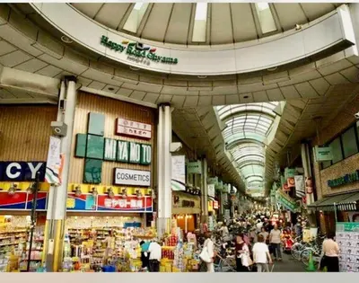 a large market with people walking around in a building at \u6c60\u888b\u4e09\u99c5\u306e\u5bb6 \u5927\u5c71\u99c5\u304b\u3089\u5f92\u6b694\u5206 in Tokyo
