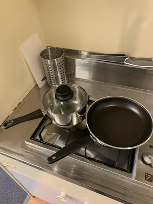 a frying pan on a stove in a kitchen at Studio in the center of Shibuya \u6e0b\u8c37\u9053\u7384\u5742 in Tokyo