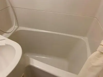 a white bathroom with a toilet and a sink at Studio in the center of Shibuya \u6e0b\u8c37\u9053\u7384\u5742 in Tokyo