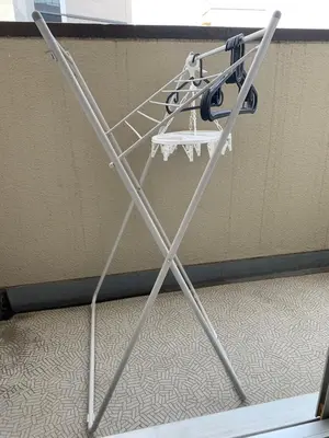 a metal stand with a table in a room at Studio in the center of Shibuya \u6e0b\u8c37\u9053\u7384\u5742 in Tokyo