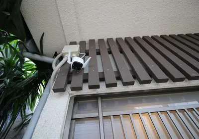 a security camera on the side of a building at HIDAKA STAY VILLA \u67f4\u53c8 in Tokyo