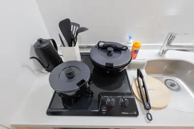 a coffee maker sitting on a counter next to a sink at Setagaya House by Tranova in Tokyo