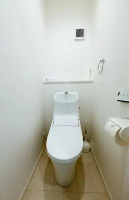 a white bathroom with a toilet and a sink at Setagaya House by Tranova in Tokyo