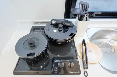 a kitchen counter with a coffee maker and a sink at Setagaya House by Tranova in Tokyo