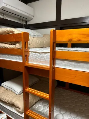 a bunk bed room with two bunk beds at 1970's Japanese style dorm house in Tokyo