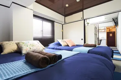 a room with three blue beds in it at Ryogoku 601 Private Cozy Stay 4min Walk Station Asakusa Nearby in Tokyo