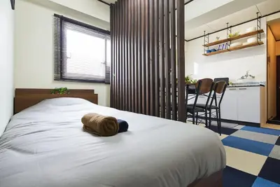 a bedroom with a bed with a stuffed animal on it at Ryogoku 601 Private Cozy Stay 4min Walk Station Asakusa Nearby in Tokyo