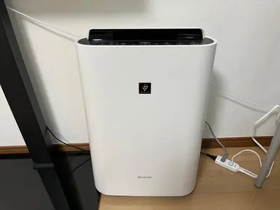 a white refrigerator with a phone on top of it at LUANAHOTEL IN SINNAKANO in Tokyo
