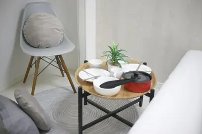 a table with a tray of food and a chair at Real Kinshi 201 in Tokyo