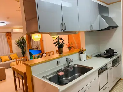 a kitchen with a sink and a counter top at Kamei House in Tokyo