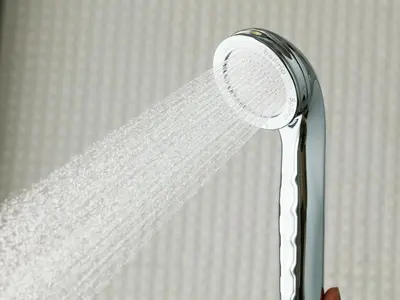 a shower head with water coming out of it at APA Hotel Nagatacho Hanzomon Ekimae in Tokyo