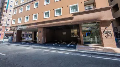 an empty parking lot in front of a building at Toyoko Inn Kayabacho Eki in Tokyo