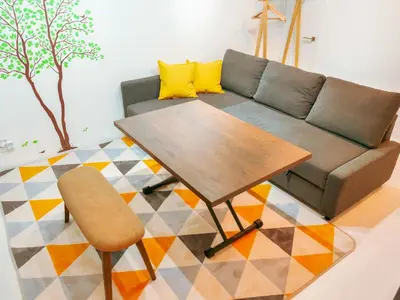 a living room with a couch and a table at 2023 Open Shinjuku Okubo 5mins to 2stns 200M WIFI in Tokyo