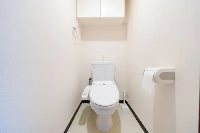 a bathroom with a white toilet in a stall at \u30ac\u30a4\u30a2\u6b4c\u821e\u4f0e\u753a\u58f1\u756a\u9928602 in Tokyo