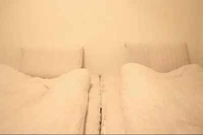 two white beds sitting next to each other in a room at Uhome Ikebukuro Villa 7 in Tokyo