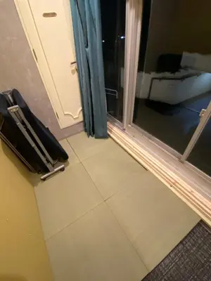 a room with a door and a window with a floor at 54Journey Roppongi in Tokyo
