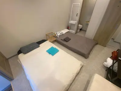 an overhead view of a bedroom with a large bed at 54Journey Roppongi in Tokyo