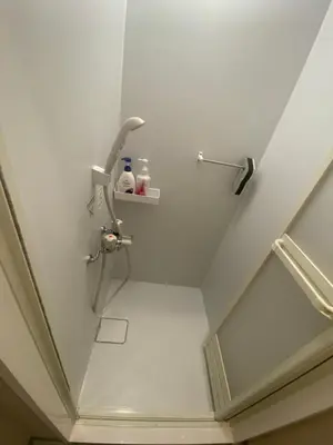 a bathroom with a shower in the ceiling at 54Journey Roppongi in Tokyo