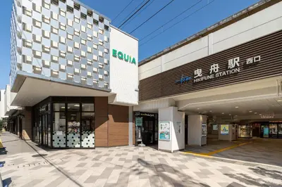 a store front of a shopping center with a building at \u58a8\u7530Dias in Tokyo