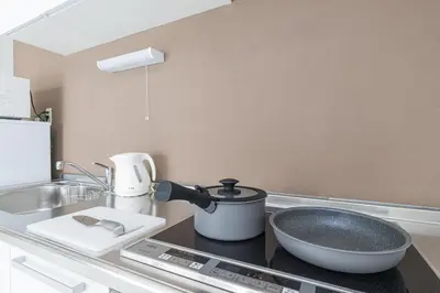 a kitchen with a sink and a bowl on a counter at Sola Stay Kanegafuchi in Tokyo