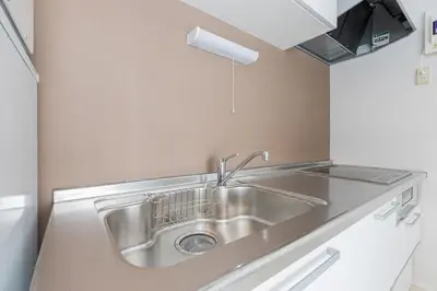 a kitchen with a stainless steel sink in a room at Sola Stay Kanegafuchi in Tokyo