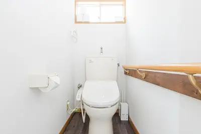 a white toilet in a bathroom with a window at Sola Stay Kanegafuchi in Tokyo