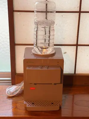 a machine with a glass jar on top of it at Tatami room & Living Room equipped with Multinational TV and Fire, BBQ corner in Tokyo Downtown House in Tokyo