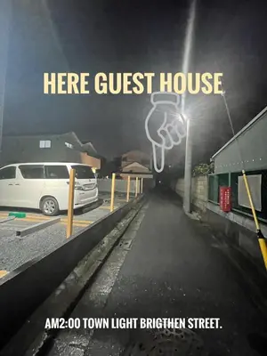 a white van parked in a parking lot with a guest house at Tatami room & Living Room equipped with Multinational TV and Fire, BBQ corner in Tokyo Downtown House in Tokyo