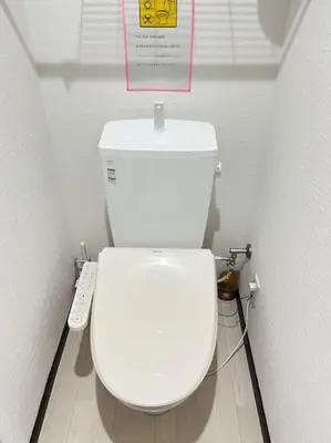 a bathroom with a white toilet with a sign above it at 203 Oshiage sta 3mins walk! Wi-Fi Elevator 4pax in Tokyo