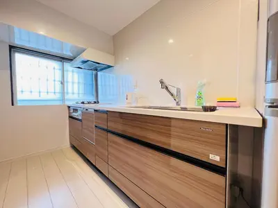 a kitchen with wooden cabinets and a sink at shinjuku Jun7F-SJ0095 in Tokyo