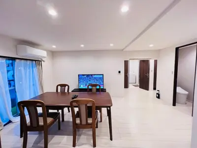 a dining room with a wooden table and chairs at shinjuku Jun7F-SJ0095 in Tokyo