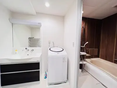 a white bathroom with a sink and a bath tub at shinjuku Jun7F-SJ0095 in Tokyo