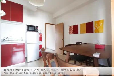 a kitchen and dining room with a table and a refrigerator at \u7834\u68c4\u30ea\u30b9\u30c6\u30a3\u30f3\u30b0 in Tokyo