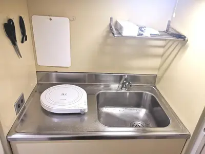 a small kitchen with a sink and a toaster at DP House in Tokyo