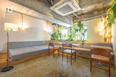 a room with a couch and chairs and plants at Hotel Residence Ohashi Kaikan Tokyo Shibuya in Tokyo