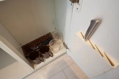 a kitchen with pots and pans on a counter at \u30ac\u30fc\u30c7\u30f3\u5927\u585a in Tokyo