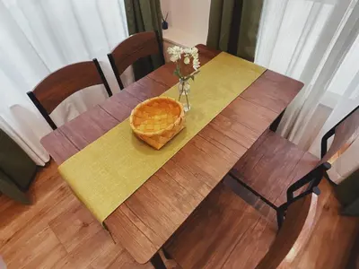 a wooden table with a basket of flowers on it at KUMOMA - Vacation STAY 92923v in Tokyo