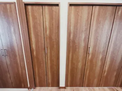 two wooden cupboards in a room with a wall at KUMOMA - Vacation STAY 92923v in Tokyo