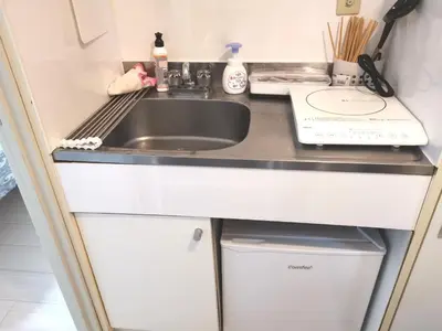 a kitchen counter with a sink and a sink at Lions Mansion Kabukicho No2 with2 bedroom in Tokyo
