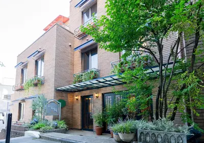 a building with plants on the side of it at Saka no Hotel Tretio Ochanomizu in Tokyo
