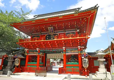 a large orange building with a clock on it at Saka no Hotel Tretio Ochanomizu in Tokyo
