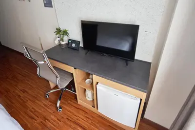 a desk with a television on top of it at TOKIO's HOTEL in Tokyo